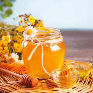 Sweet flavored honey jar honeycomb small bowl bouquet wild flowers background summer garden concept 79919 4595