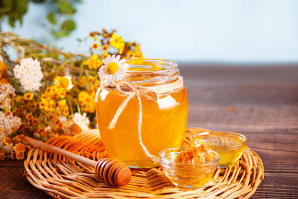 Sweet flavored honey jar honeycomb small bowl bouquet wild flowers background summer garden concept 79919 4595
